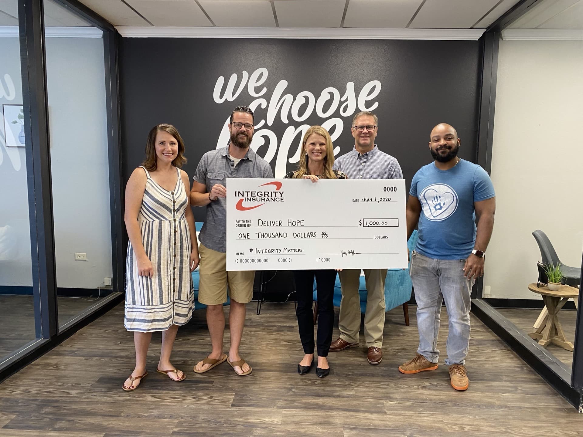Integrity Insurance team donating to Deliver Hope