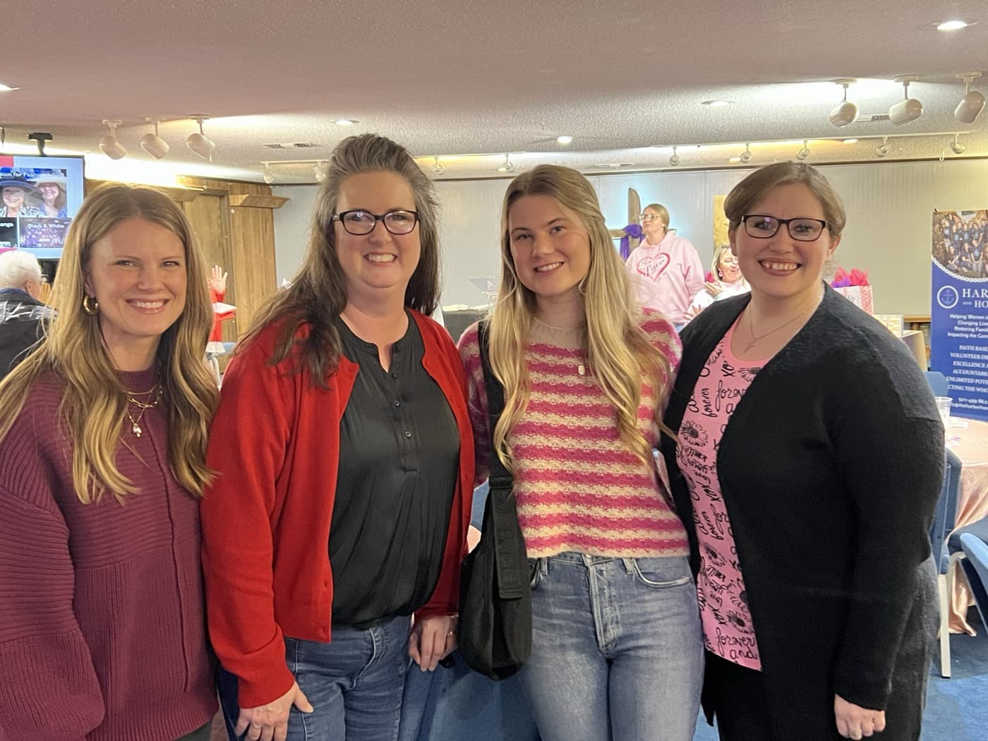 Integrity Insurance team donating to Harbor Home