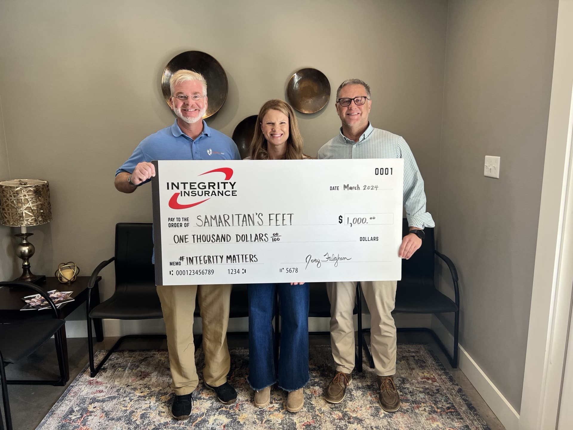 Integrity Insurance team donating to Samaritan's Feet